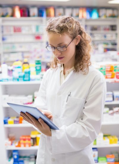 pharmacist-using-tablet-pc-at-the-hospital-pharmacy